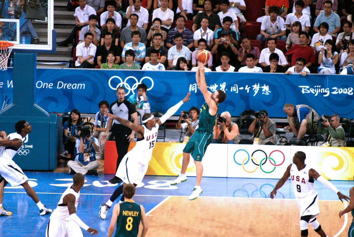 Basketballer shooting a basket.