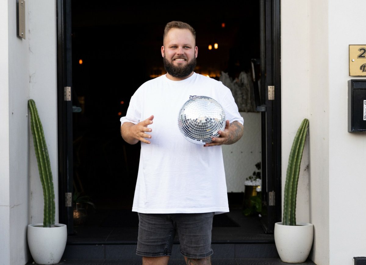 Barry Pearson holds a disco ball