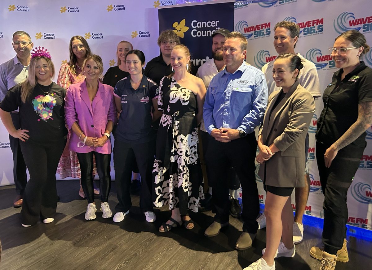 Stars of Wollongong pose in front of media wall