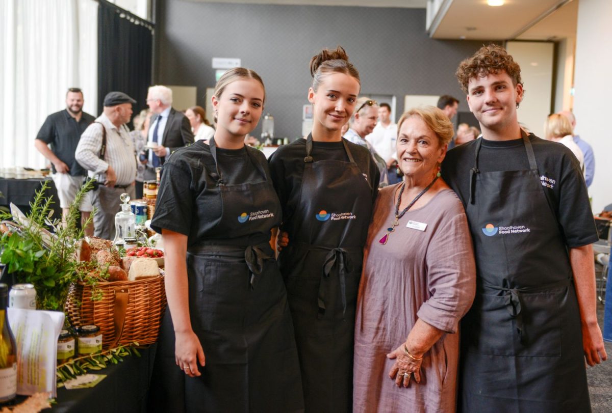 Woman and three young chefs