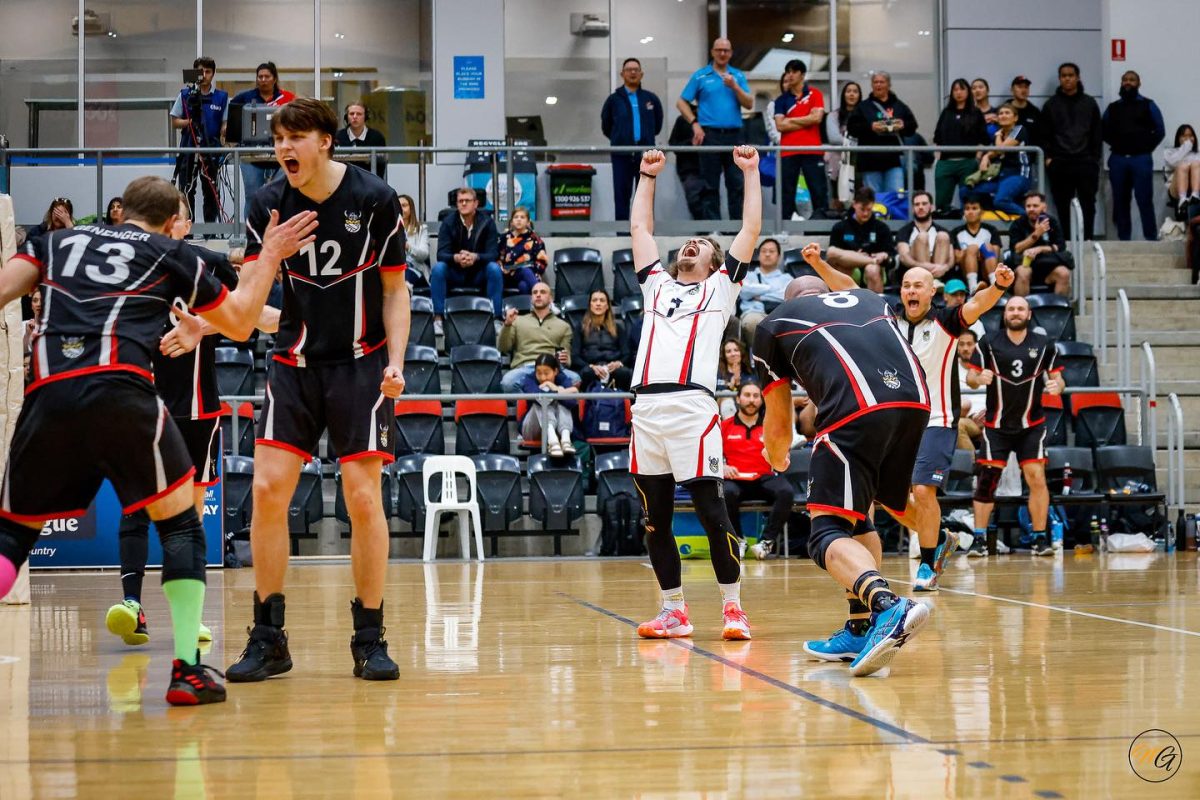 The Illawarra men's team celebrate winning the premier division of the Sydney Volleyball League in 2022.