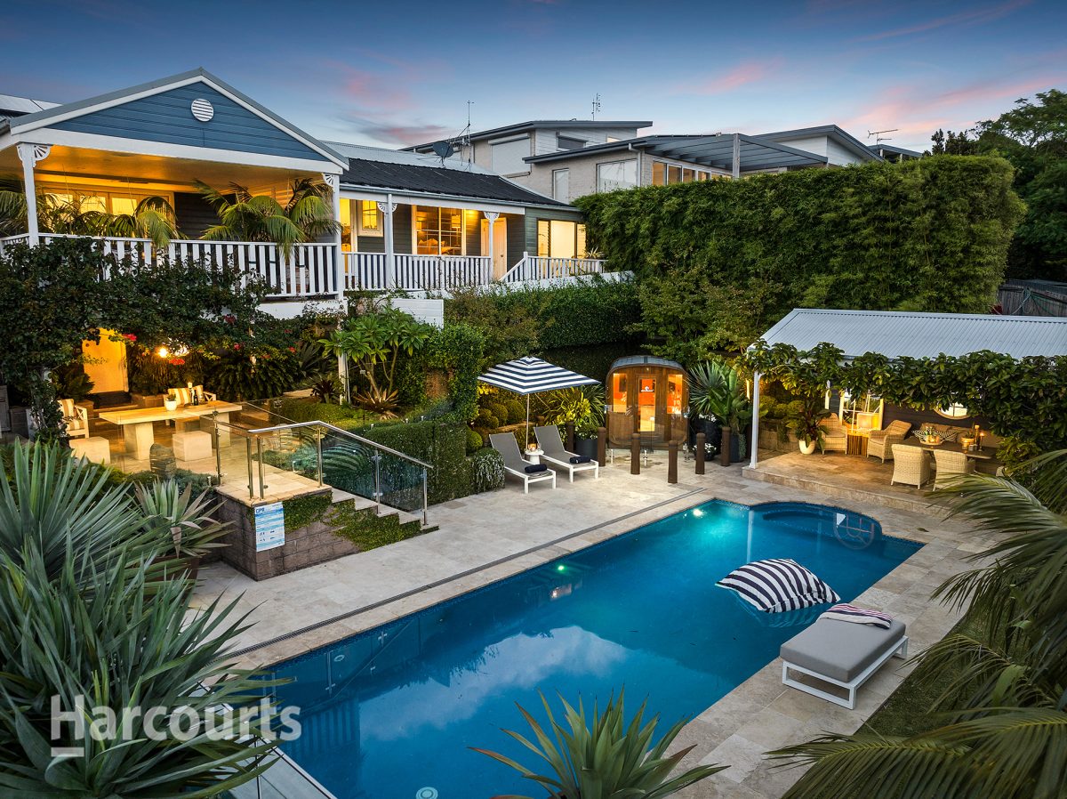 Home and pool lit up at night
