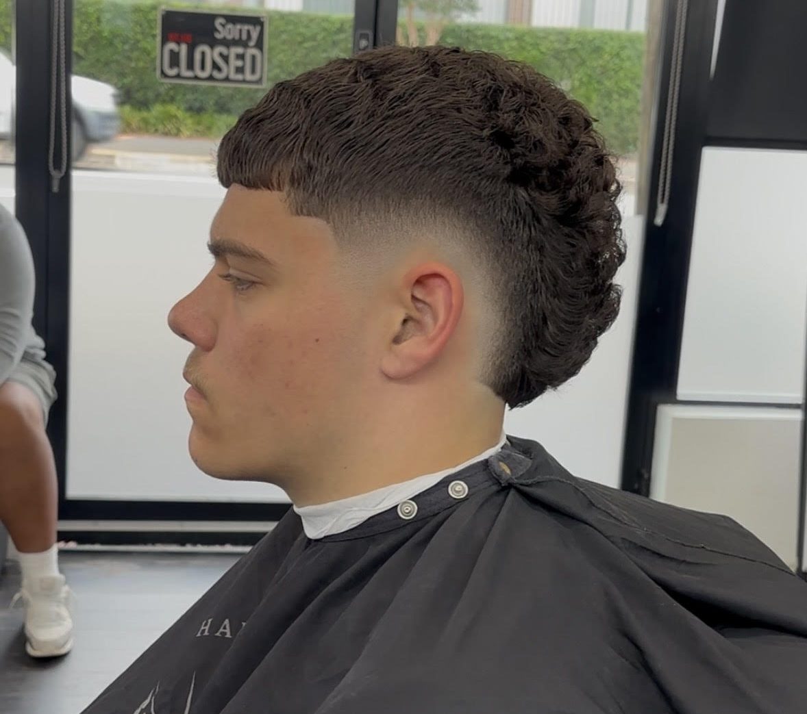 Man showing off haircut