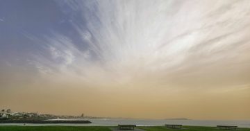Dusty haze hovers after drifting interstate