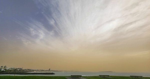 Dusty haze hovers after drifting interstate