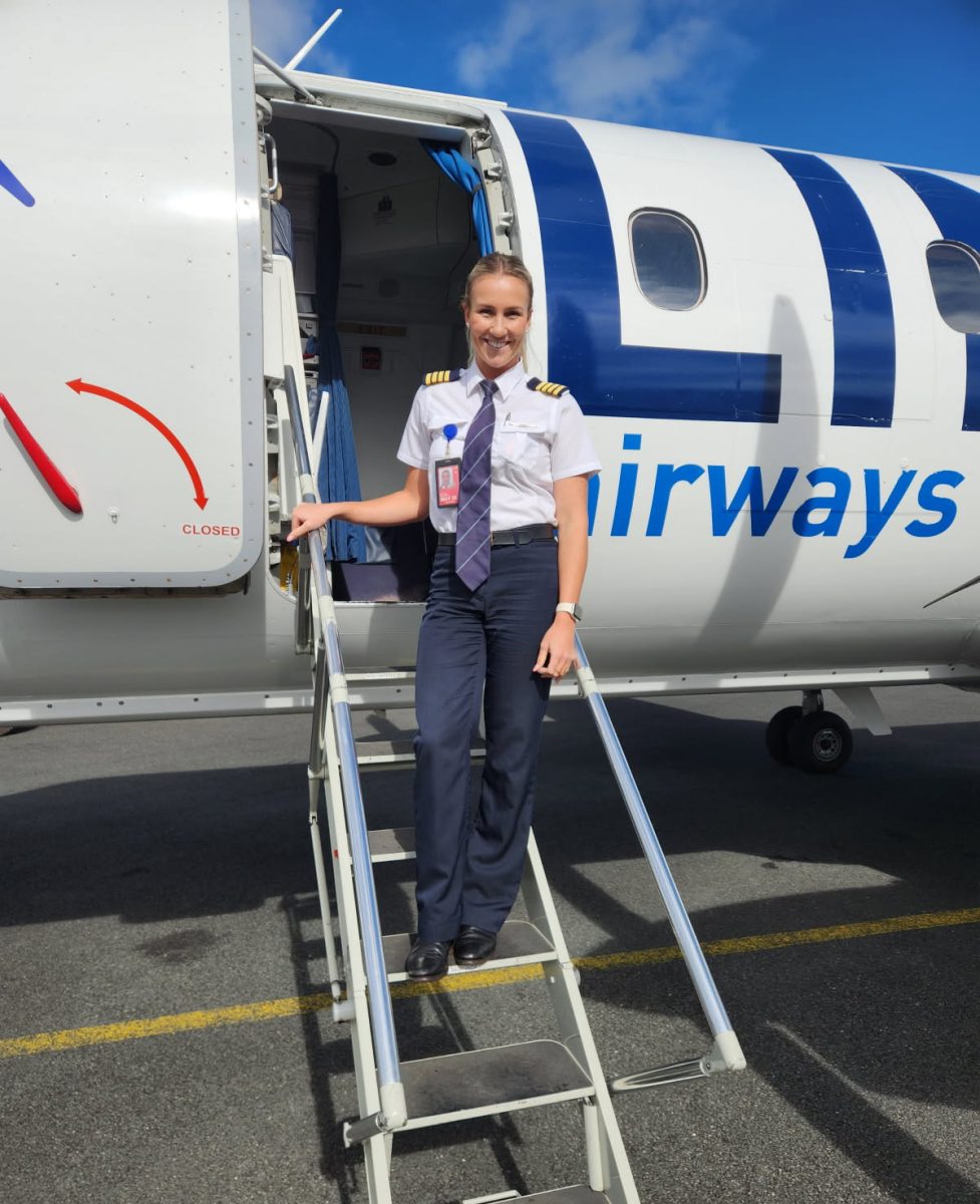 Pilot on steps of plane
