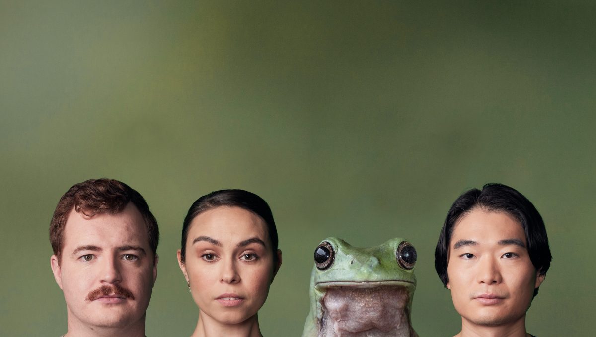 Three people and a frog