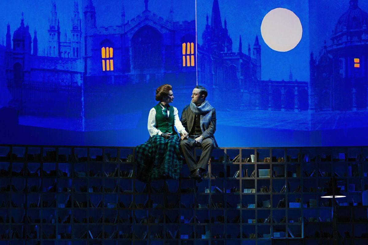 still from The Dictinary of Lost Words on stage - a man and woman look at each other in the moonlight