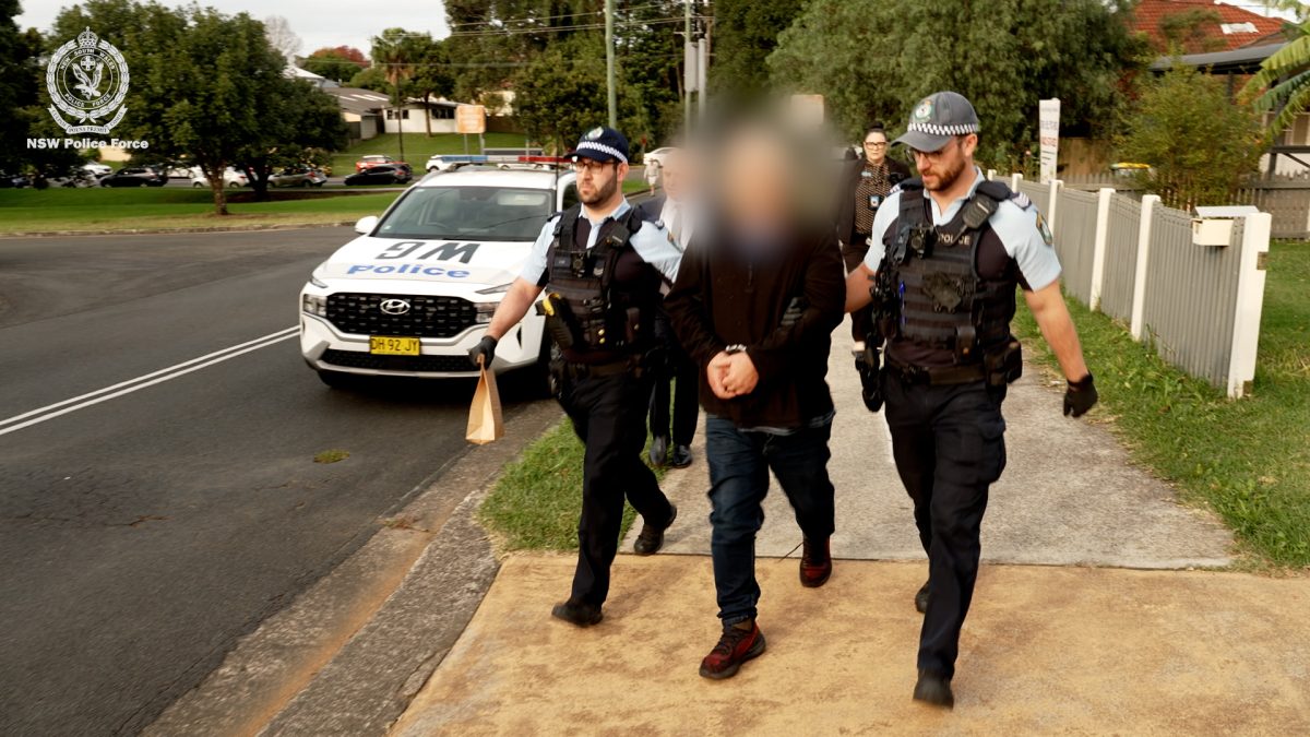 arrested man with police
