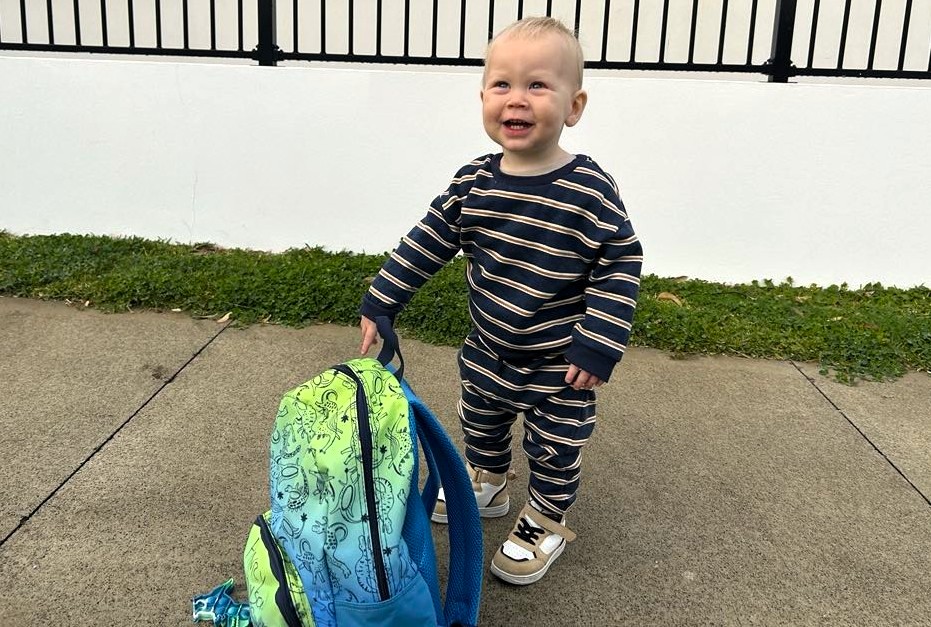 Henry with backpack about to start childcare.