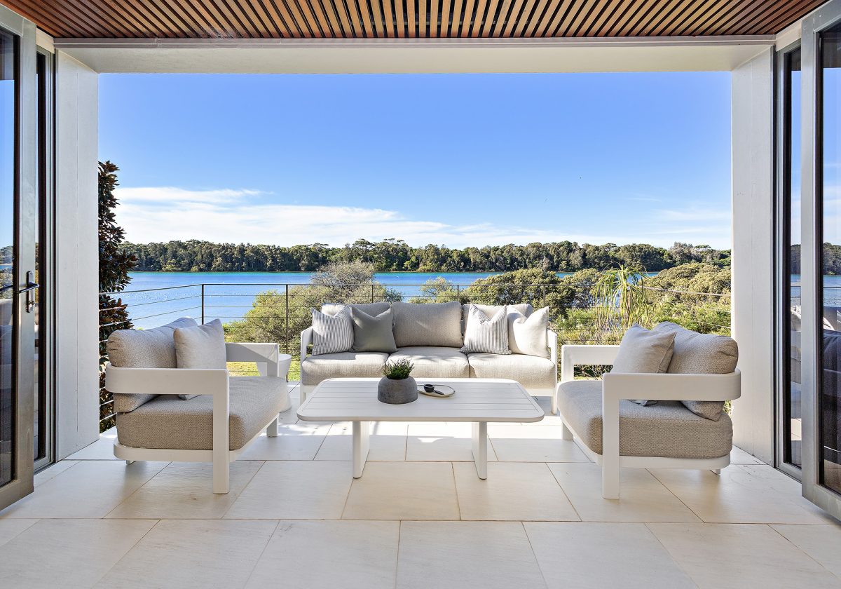 Couches on balcony overlooking river