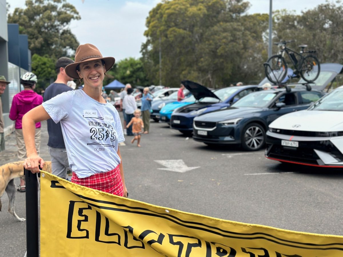 Person in front of Electrify 2515 banner