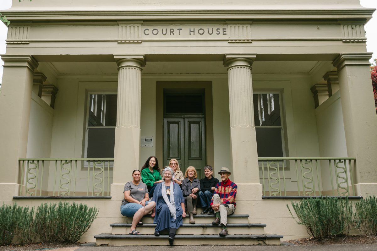 People sitting on courthouse steps