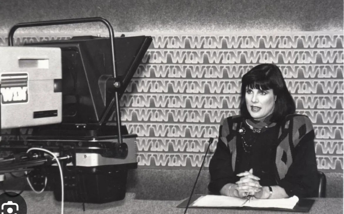 Female presenter in front of camera