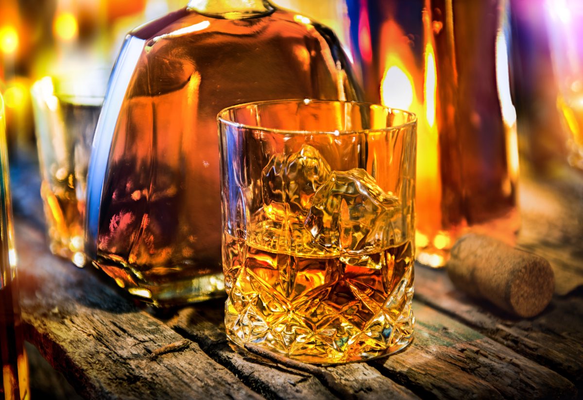 Close-up on whiskey bottle and glass