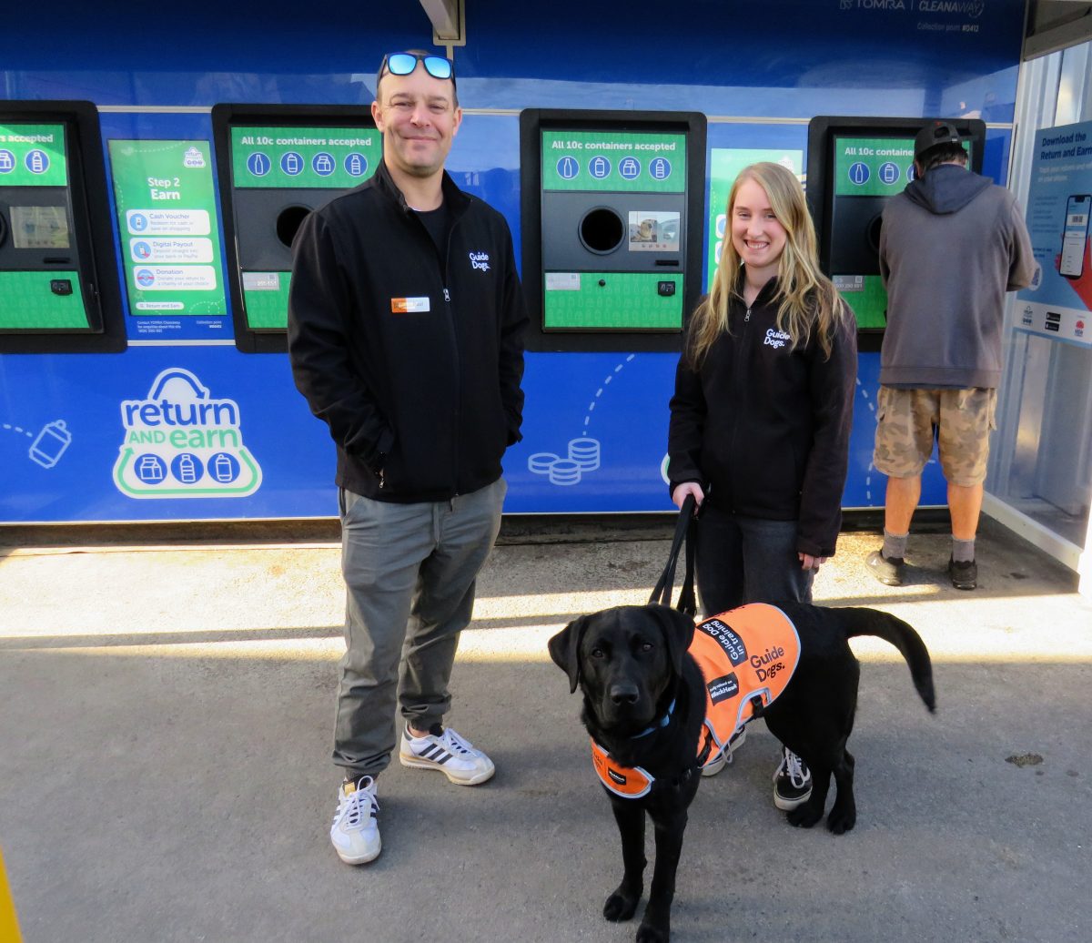 Paul Hartley and Elyse Marr from Guide Dogs Australia with guide dog Wallace at the upgraded Return and Earn facility in West Wollongong.