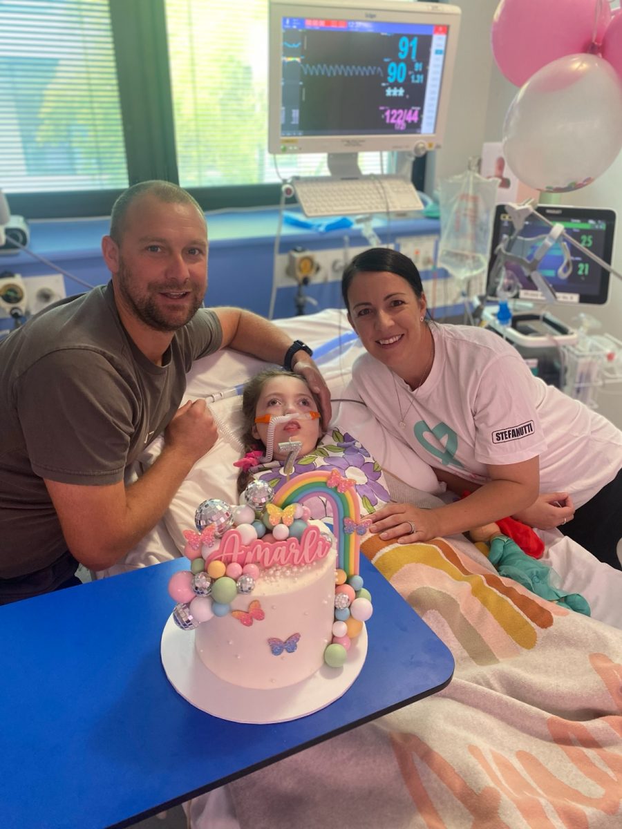 Amarli with her parents, Lee and Jade, on her seventh birthday.