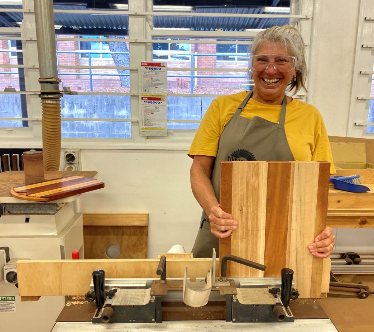 Woman with wooden chopping block