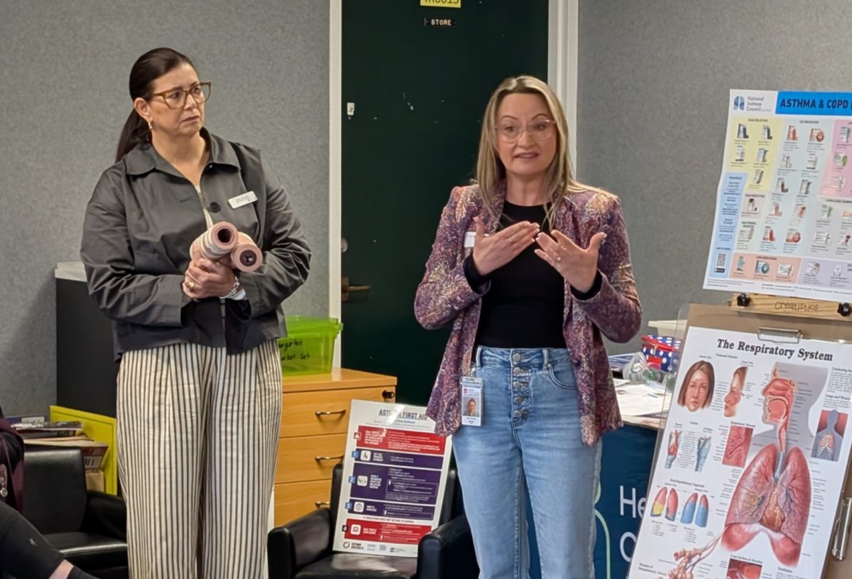 a woman giving a talk on asthma