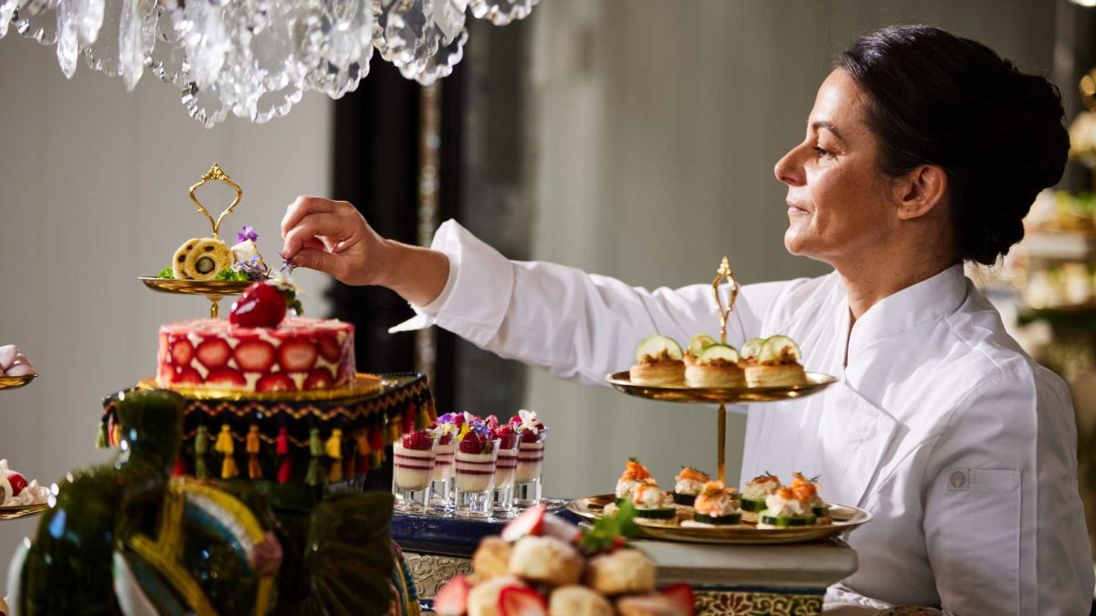 Chef puts finishing touches on a high tea arrangement