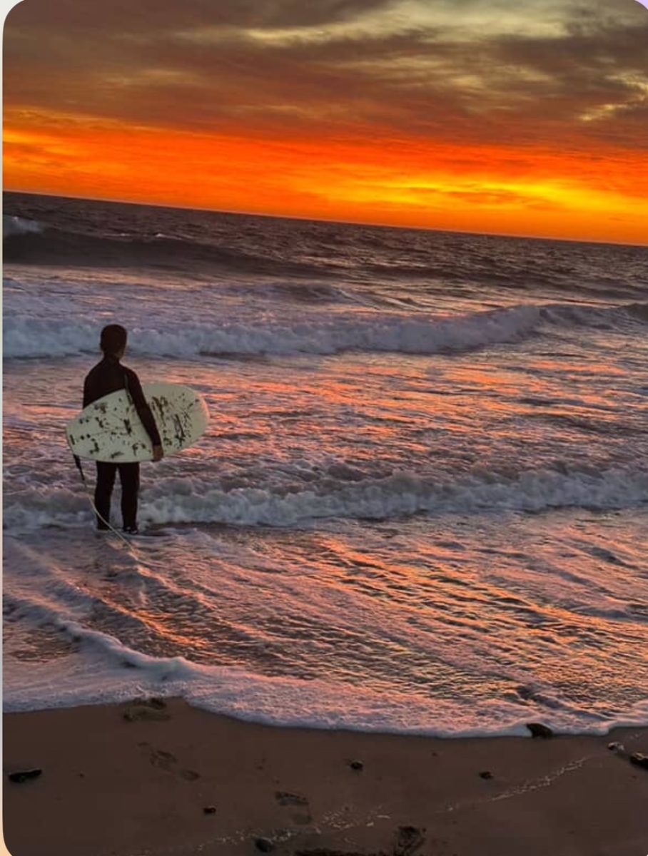 Boy with surfboard