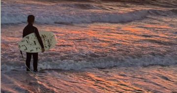 Father and son riding high on the simple kindness of a surfing stranger