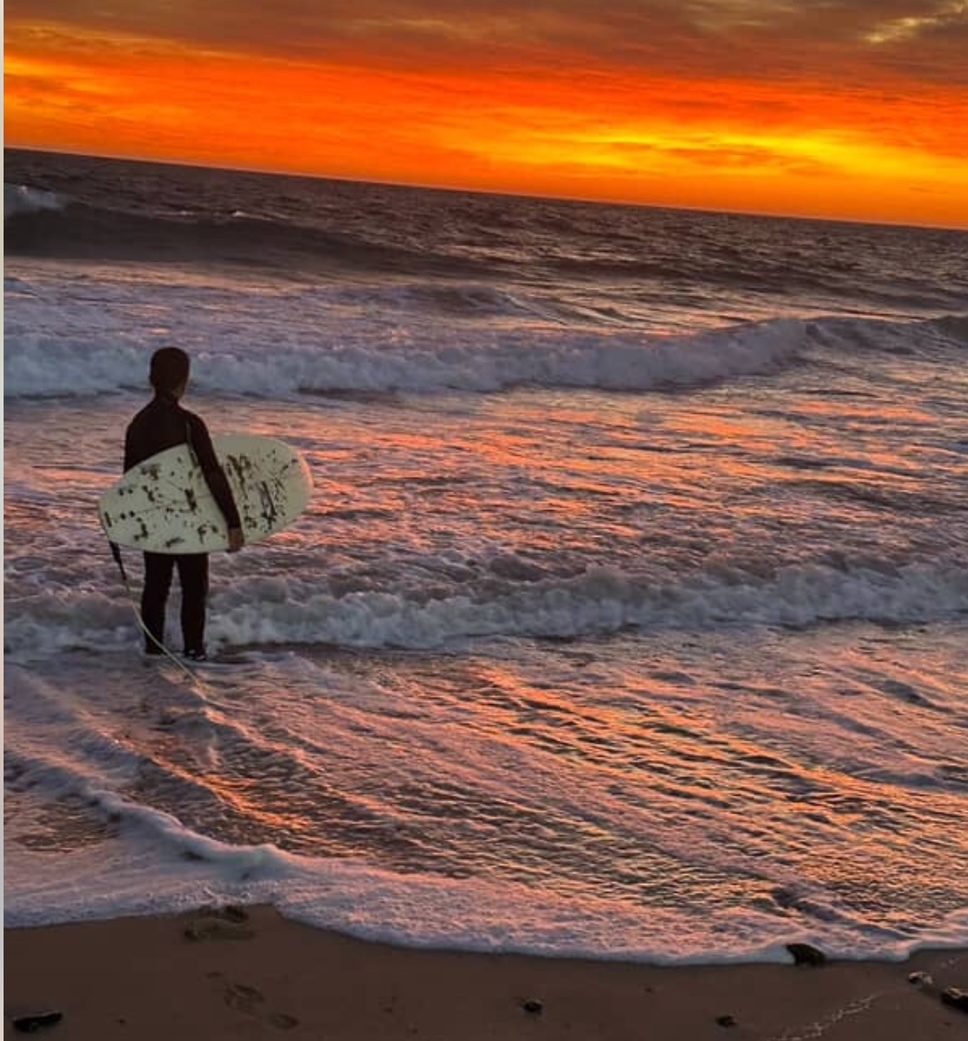 Boy with surfboard