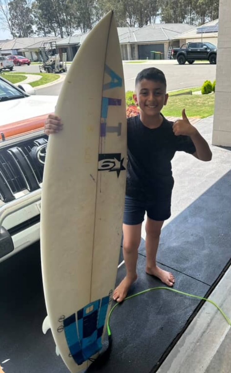 Boy with surfboard