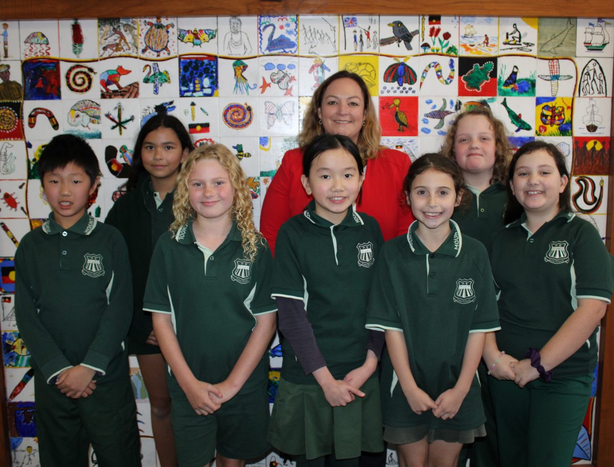 Emily Jones with some students from year 3 and 5.