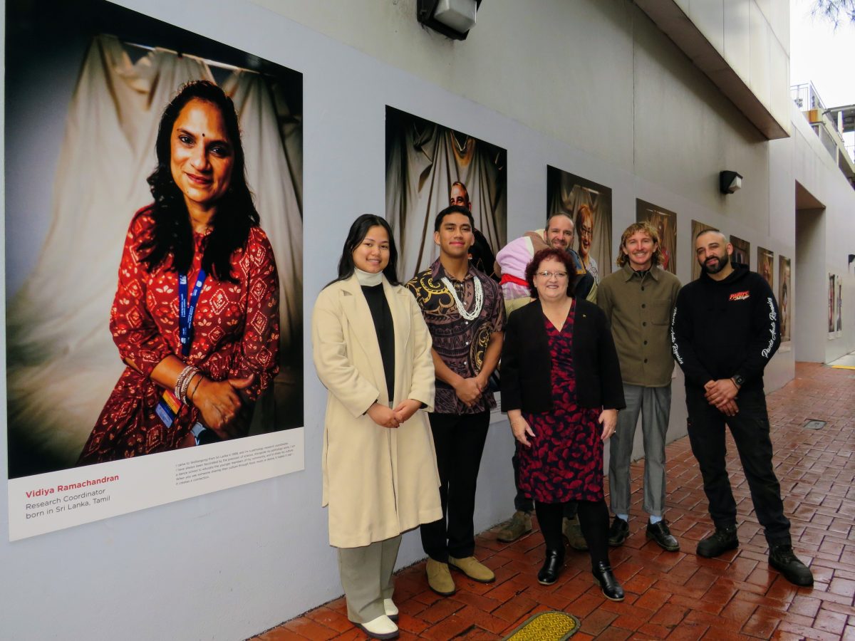 Subjects of a new art installation on Bonacina Walkway, Boe Hsophu, AJ Arthur Junior Rapana, Daniel Carpentier carrying Mila Carpentier and Alex Paradisis with photographer Tad Souden and Wollongong Lord Mayor Tania Brown.