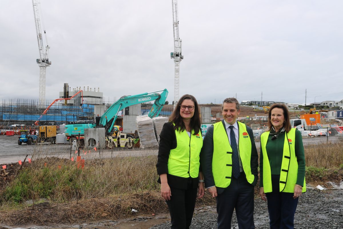 Three people on construction site
