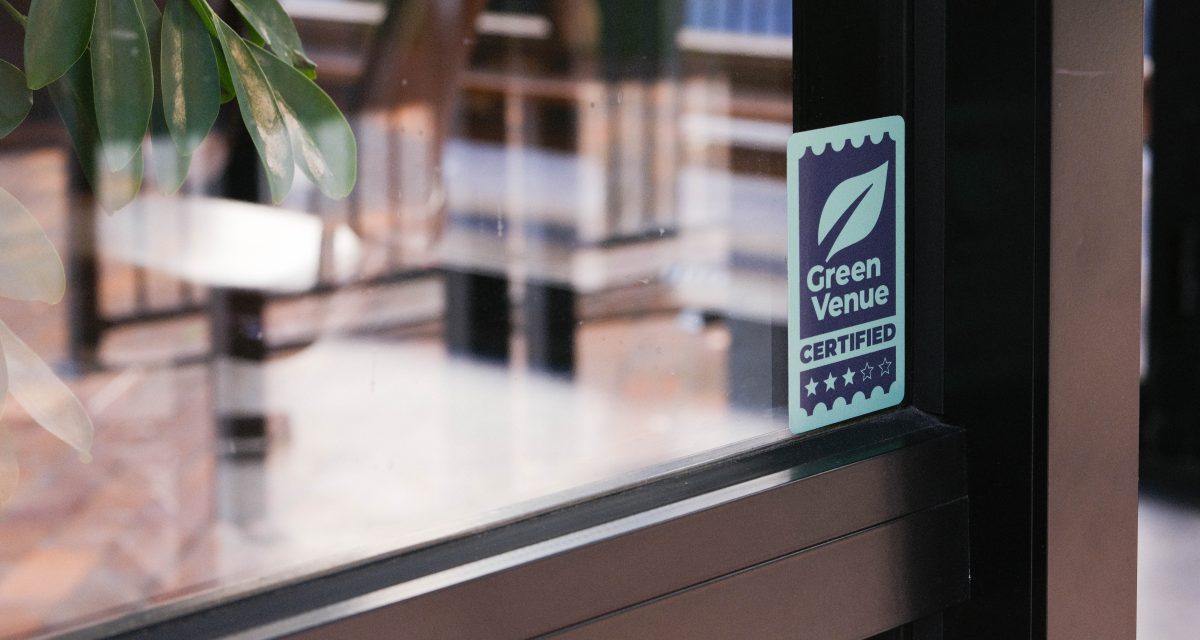 window sticker saying Green Venue