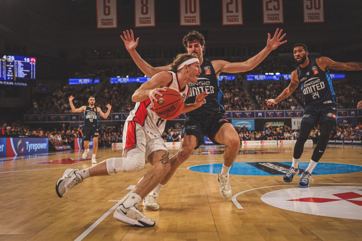 Two basketball players on court