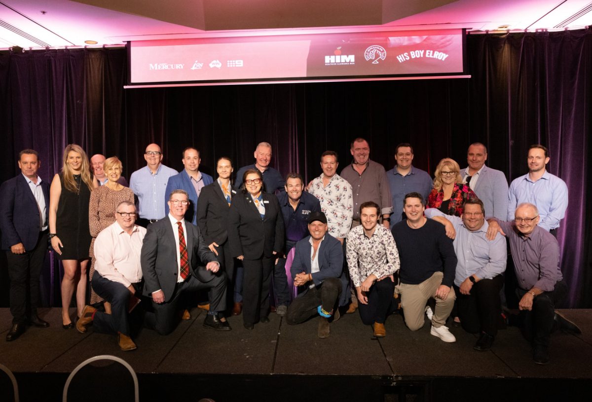 group of people on stage at a fundraising function