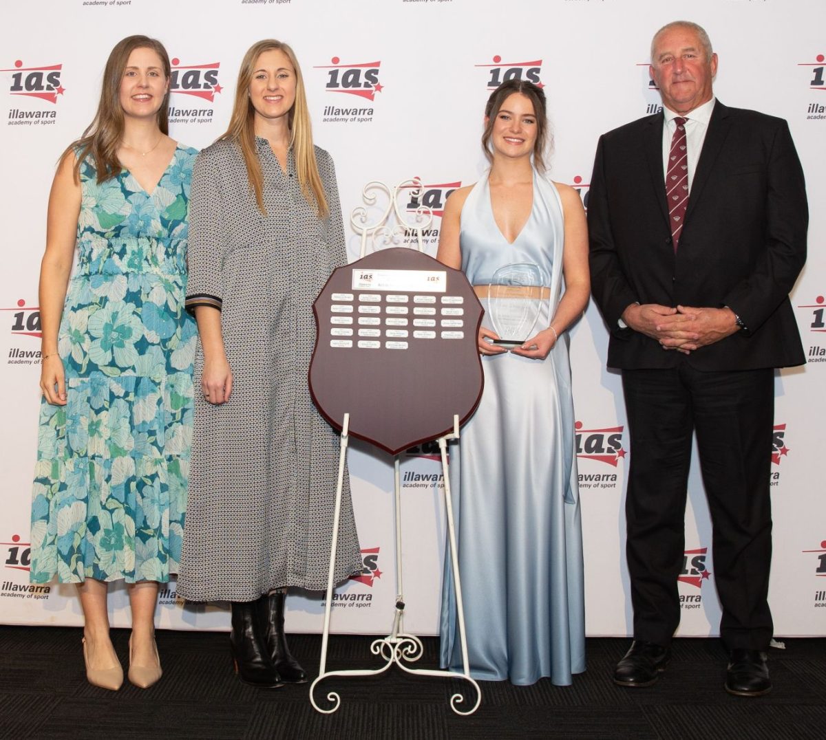 Four people with trophy