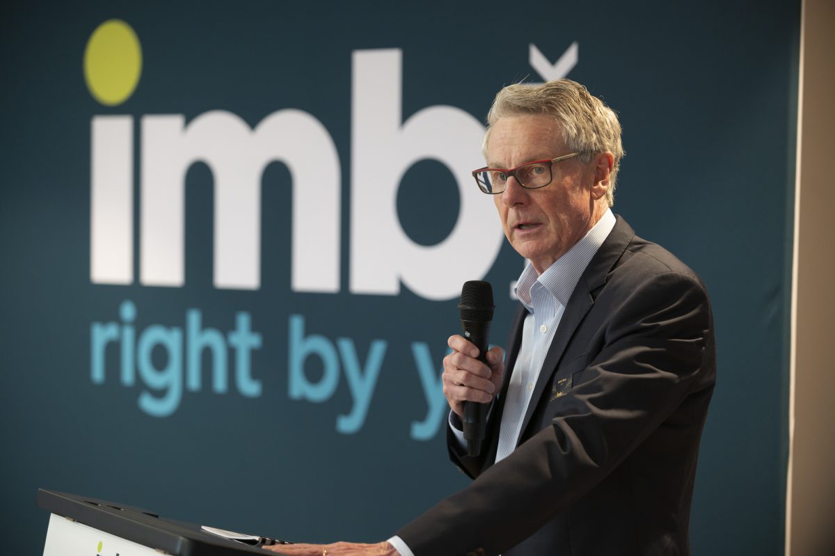 IMB CEO Robert Ryan speaks into a microphone