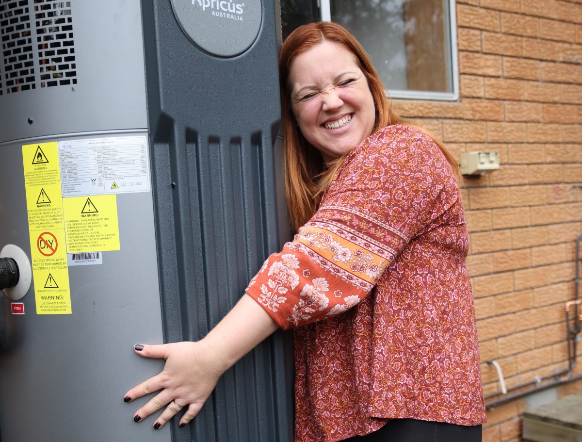 Woman hugs a water heater