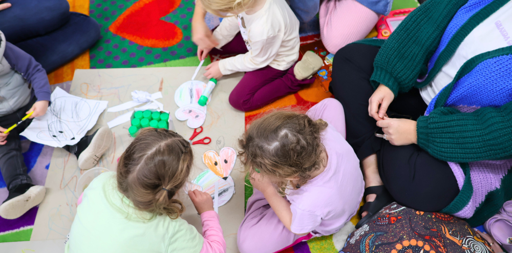 kids doing arts and craft on the floor
