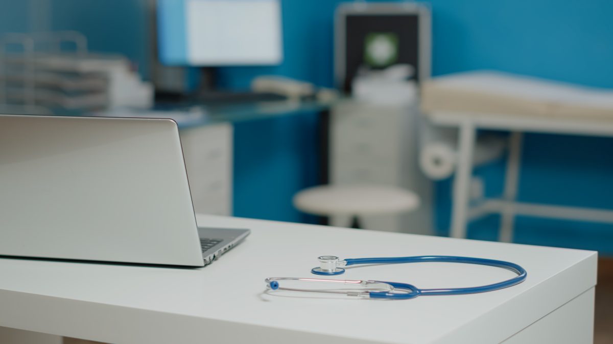 Computer and stethoscope on desk