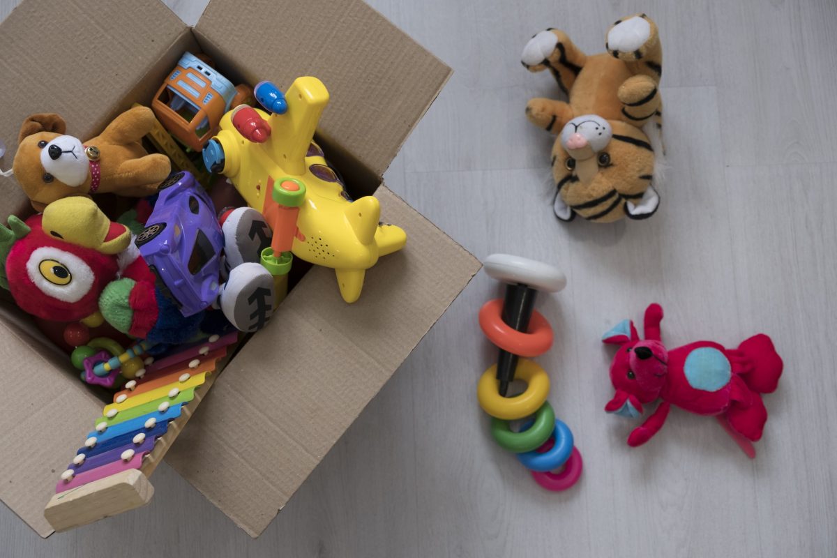 Overflowing cardboard box of toys