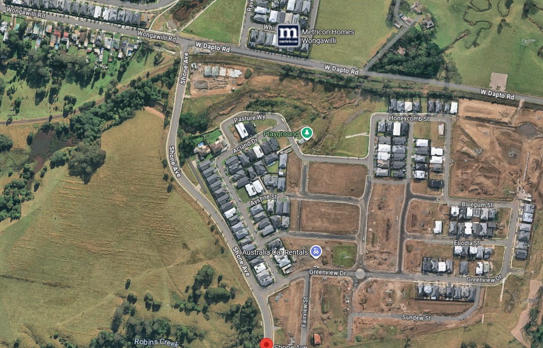 The vacant land to the left of Shone Avenue will become home to the new West Dapto primary school and preschool.