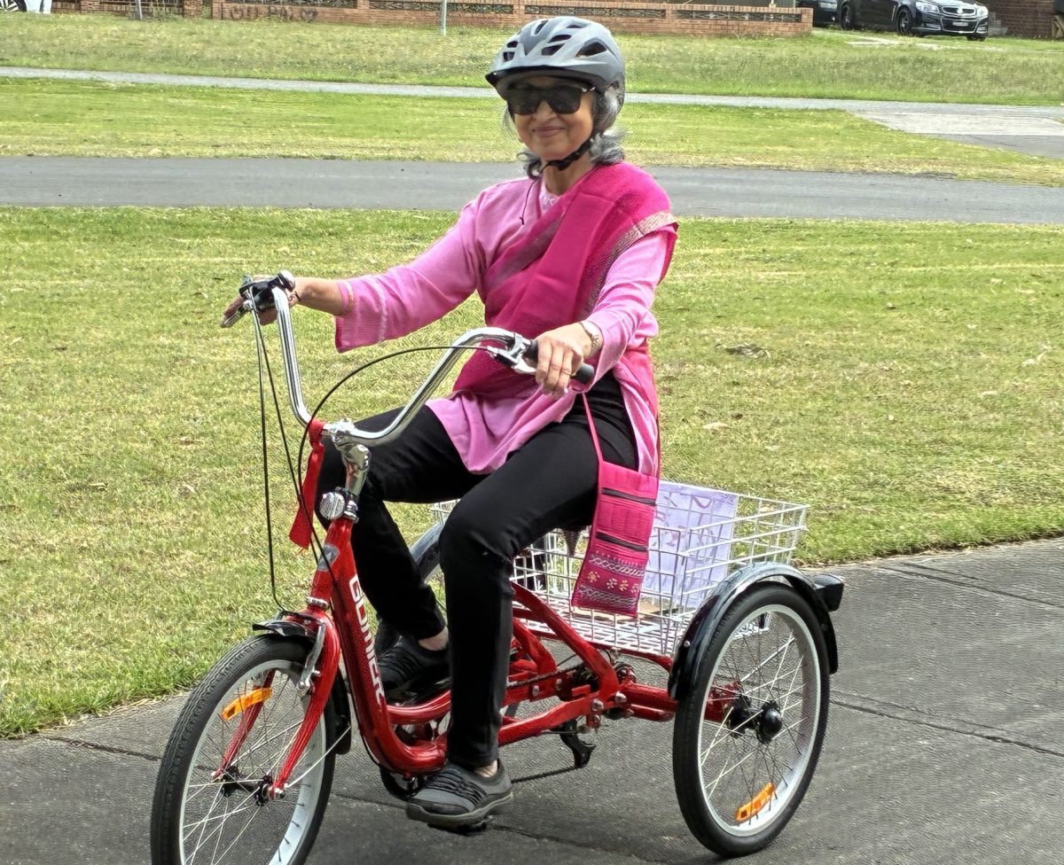 Woman in pink on bike