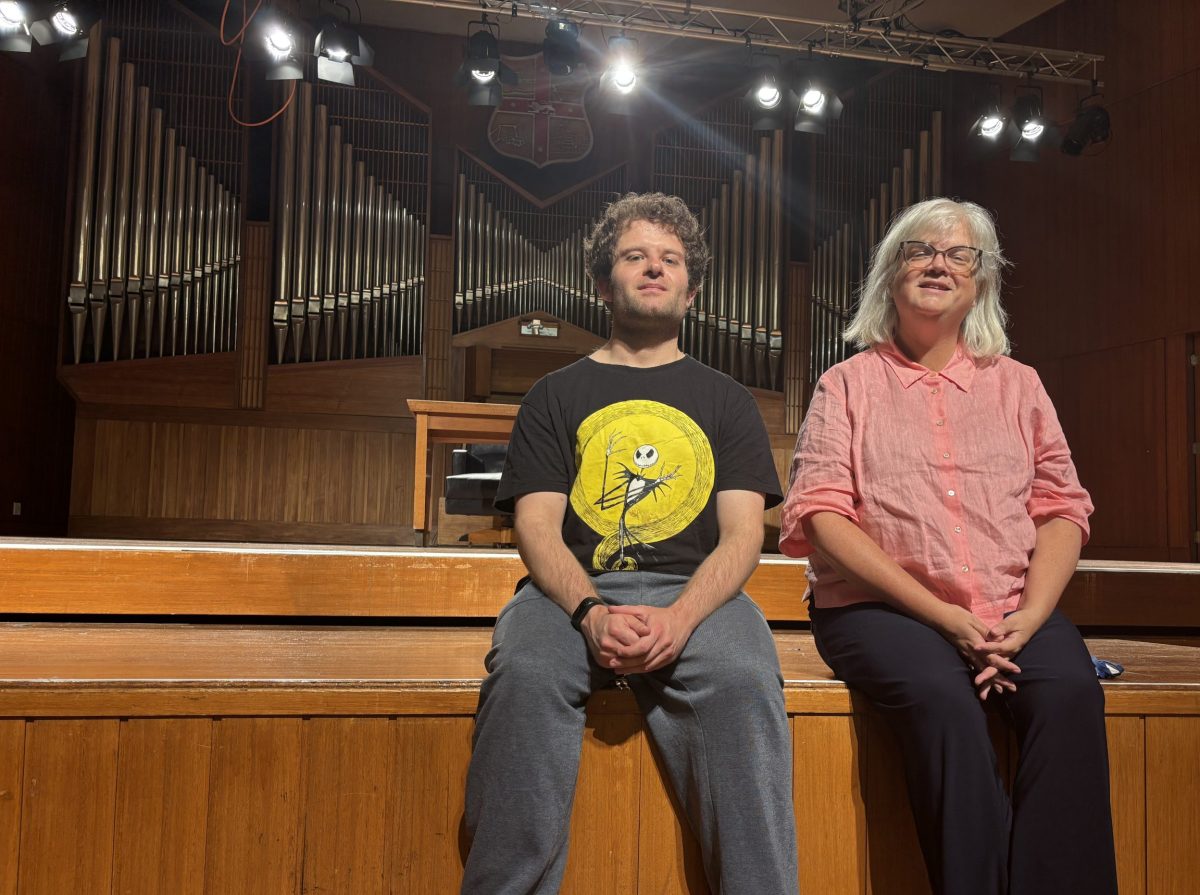 Christian Tagliaferro and Anne-Louise Rentell sit on a stage at Wollongong Town Hall