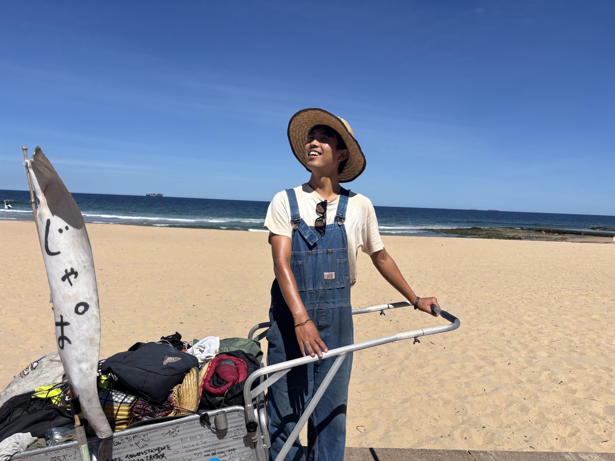 Tomoya Matsusaka with his trolley at Austinmer Beach