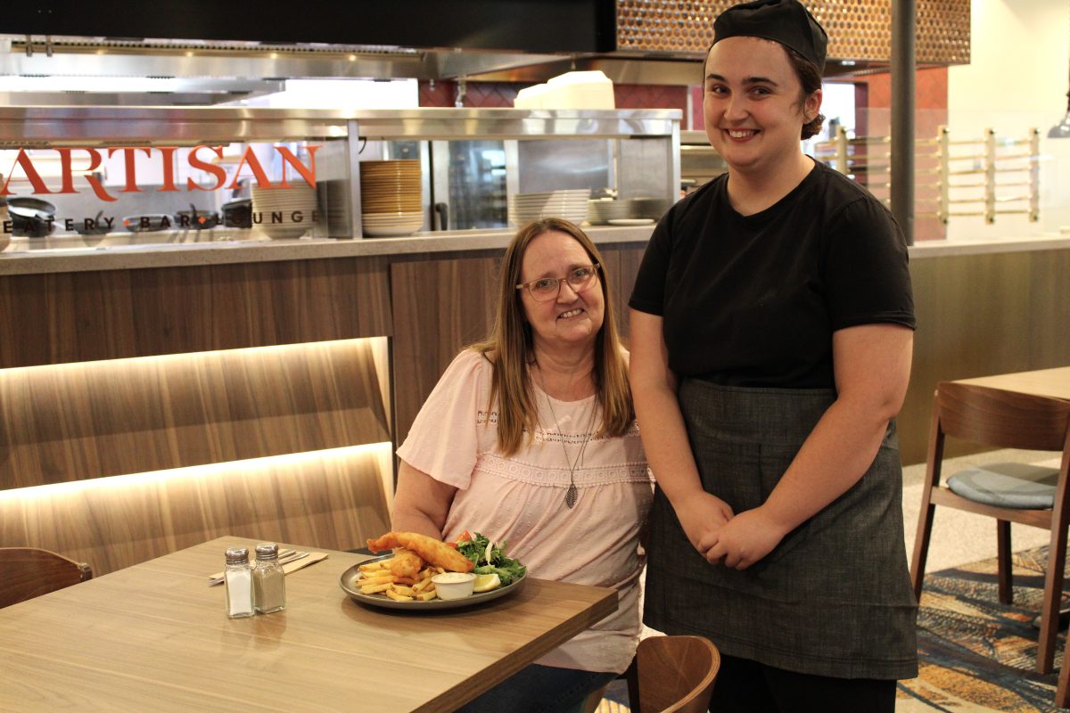 a mother and her daughter in a restaurant where the daughter works