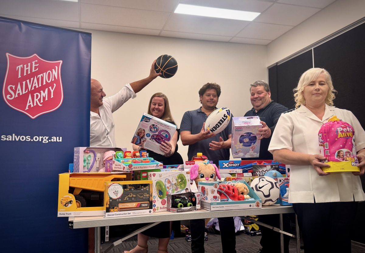People near a table of gifts