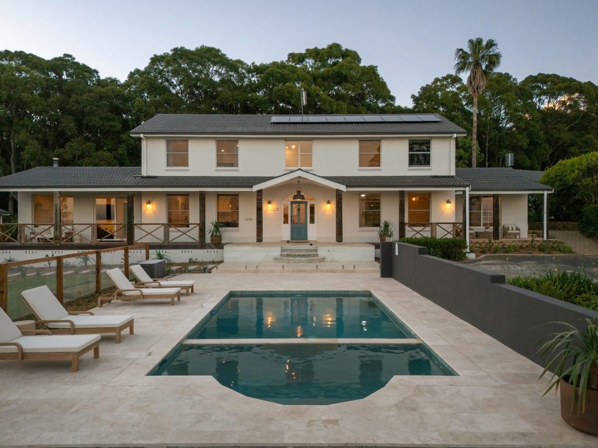 Back view of home with pool