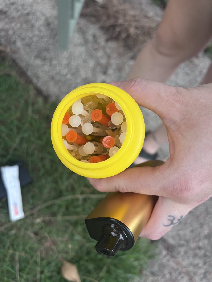 One of several containers full of syringes Steph Fahy has cleaned up from a residential street in Woonona. 
