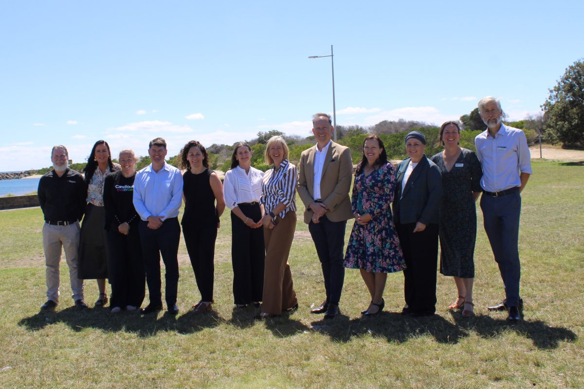 12 people standing in a line