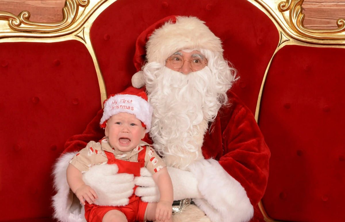 Crying child with santa